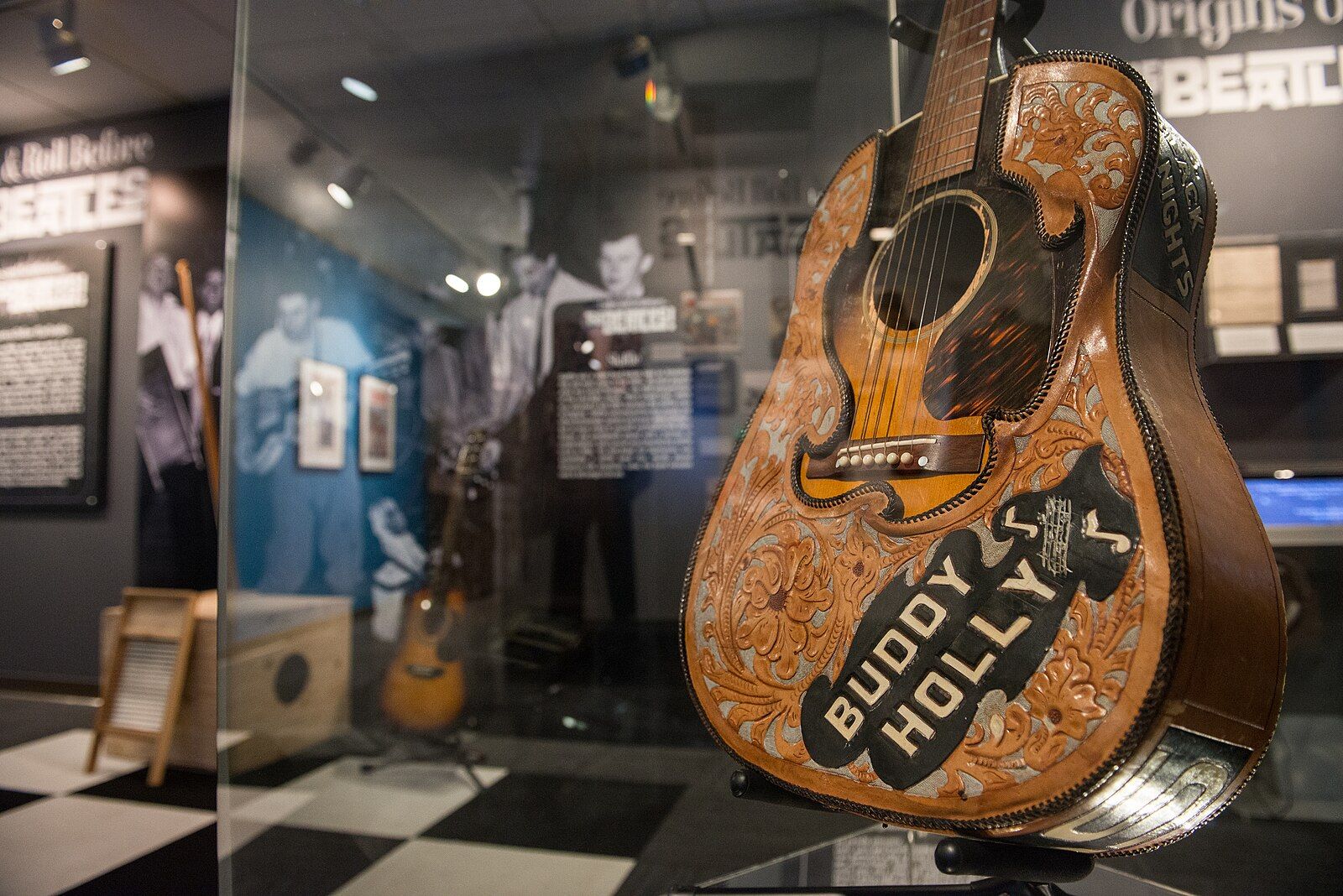 Buddy_Holly's_Gibson_J-45_with_leather_cover_-__Ladies_and_Gentlemen..._the_Beatles!__exhibit_at_LBJ_Presidential_Library,_Austin,_TX,_2015-06-23_16.12.04.jpg